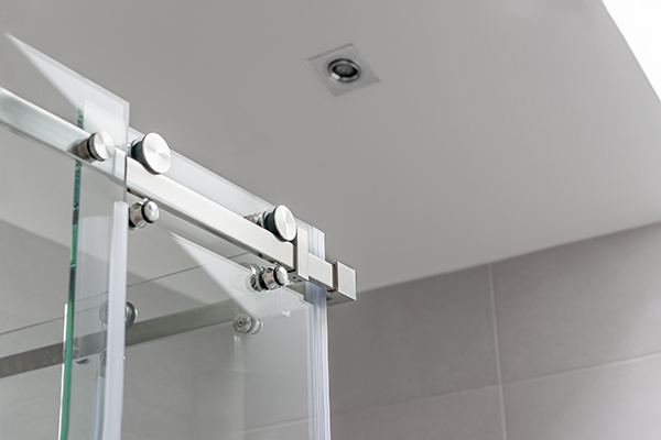 a smooth frameless bypass sliding door is good for your condo bathroom